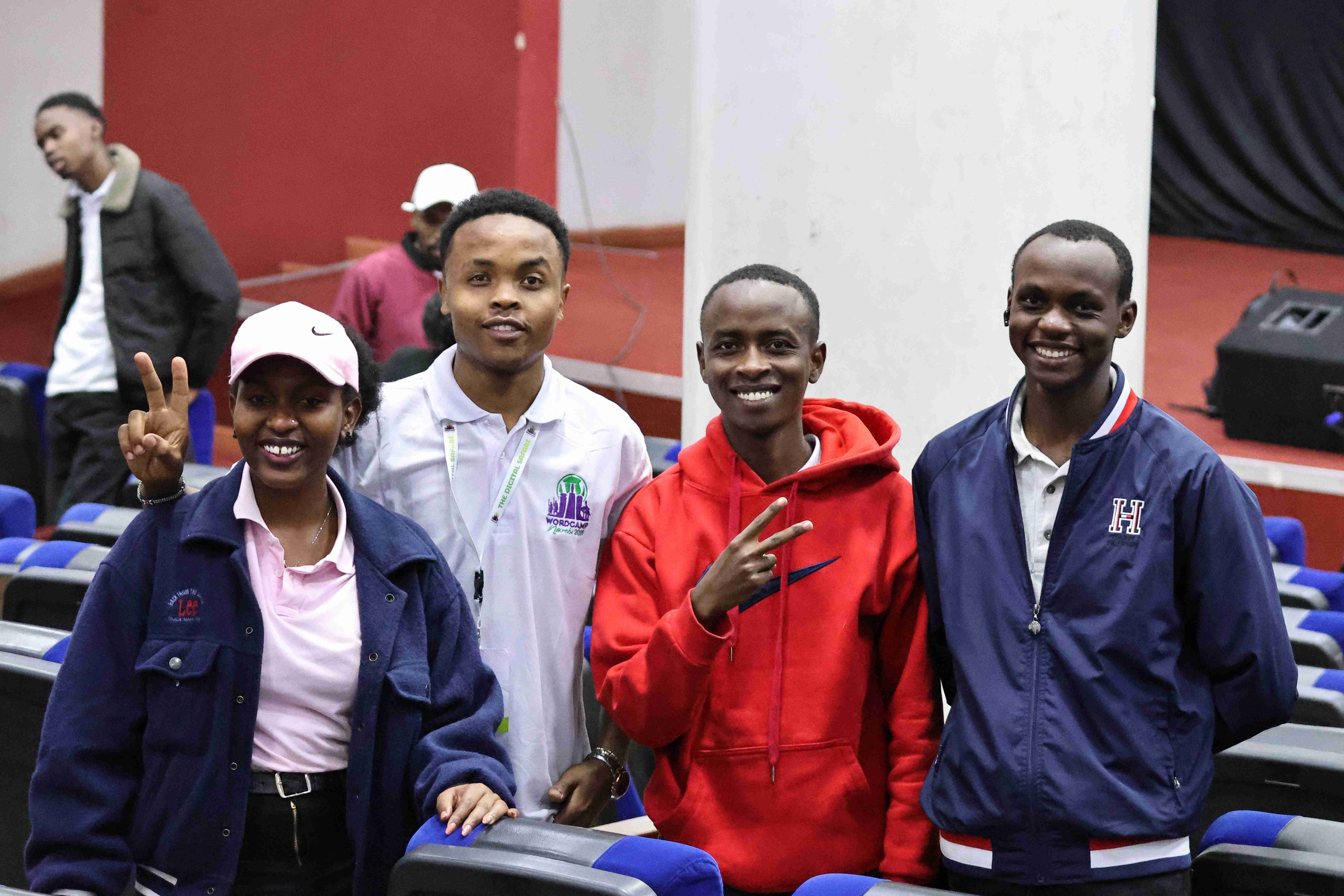 WordCamp Nairobi 2025 attendees posing for photo at Daystar University main auditorium