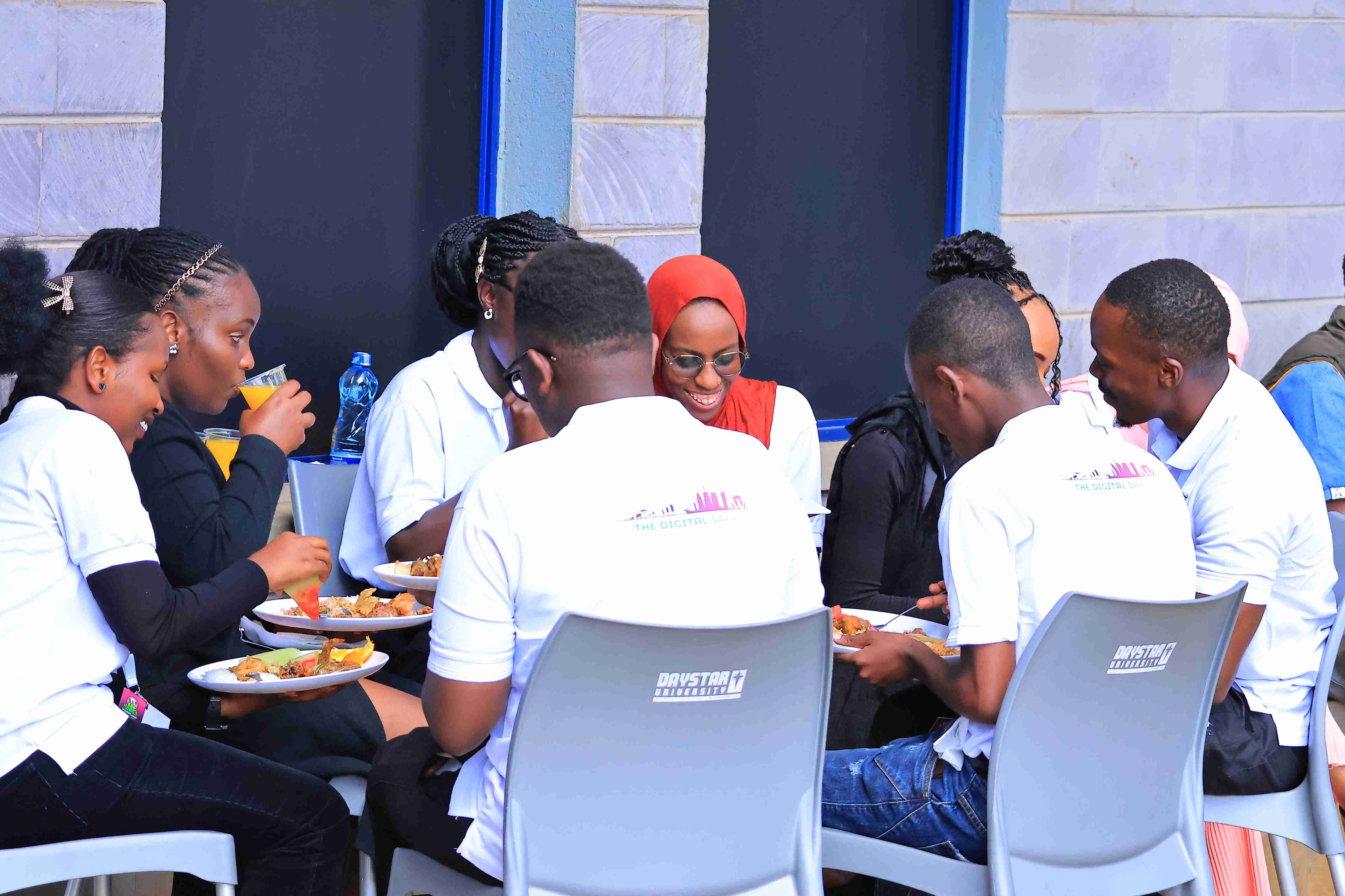 Attendees eating during WordCamp Nairobi 2025 break at Daystar University